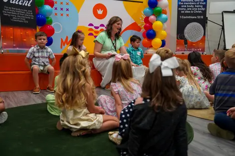 Kids gathered with their leader in the kids ministry room