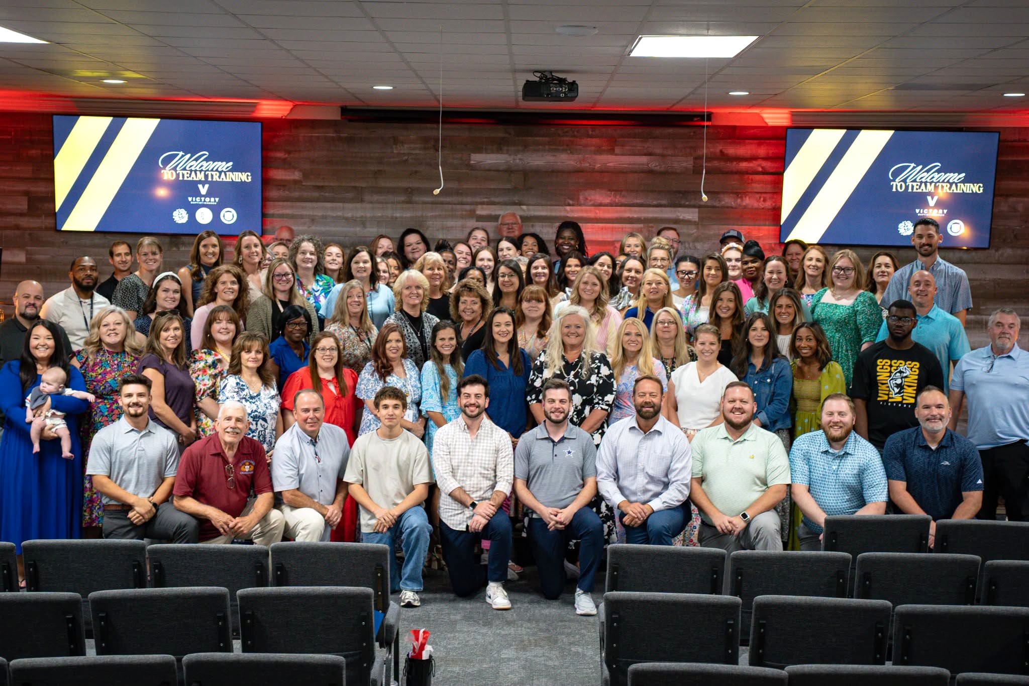 Victory's Dream Team gathered in the sanctuary for a group photo at team training