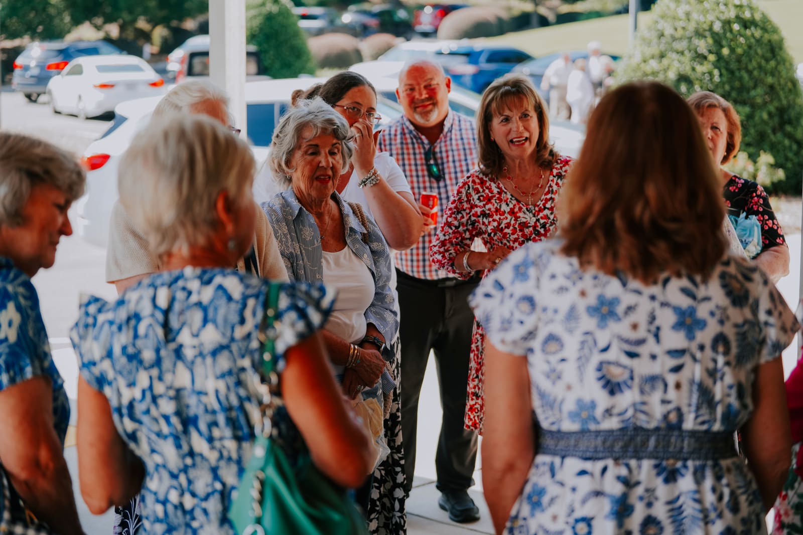 Senior members greeting one another outside the entrance