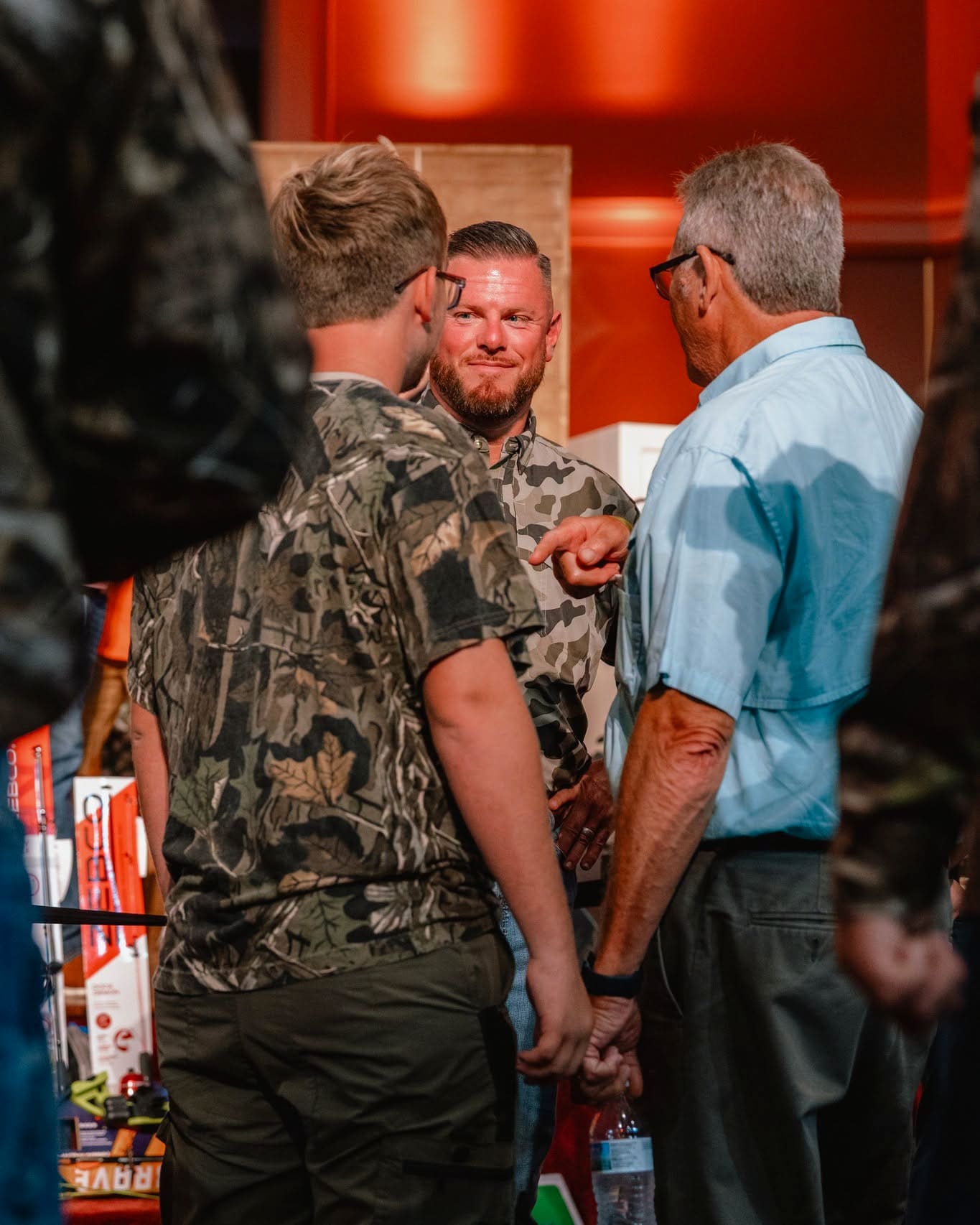 Two men in conversation in the hallway after a service