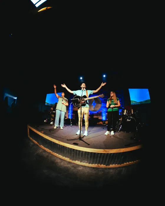 The Victory Teens worship band on stage under the lights