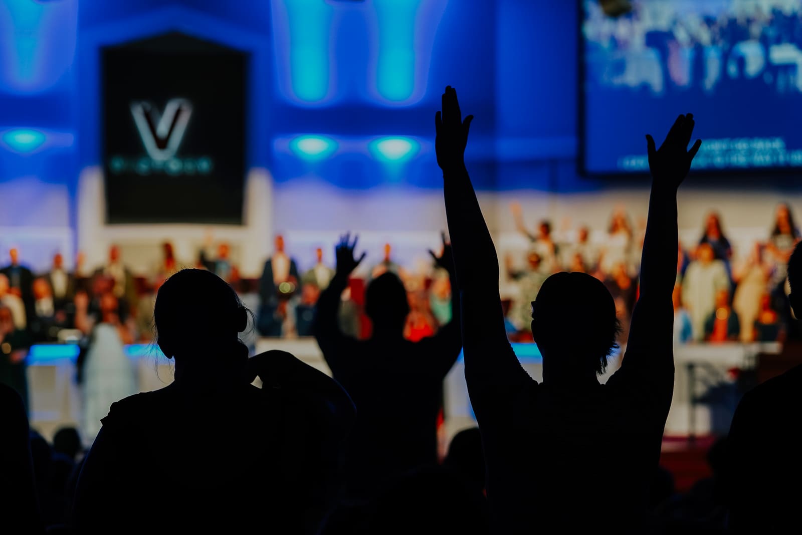 Hands raised during worship at a Sunday service